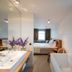 Bij Jef in Den Hoorn bathroom with double sink, freestanding tub, and view into the bedroom