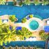 Phuket Graceland Resort & Spa Patong aerial view of lagoon pool, swim-up sun loungers and palm trees
