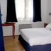 Logis Hôtel Restaurant Auberge Saint Martin guest room with double bed and window in Saint-Gatien-des-Bois