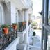 Balcony view at Sammy Dalat Hotel in Dalat with ornate railings and potted plants