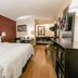Red Roof PLUS+ Nashville South - Fairgrounds room with king bed, desk and TV in Nashville