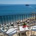 Hotel Lido Mediterranee in Taormina balcony with sea view, beach umbrellas, and lounge chairs