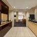 TownePlace Suites by Marriott Williamsport breakfast area with self-serve drinks, cereal, fruit, and seating