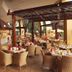 Soho Hotel & Casino at Sun City Resort restaurant with open-air dining and set tables
