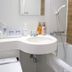 Karasuma Kyoto Hotel bathroom with sink, bathtub, shower wand and toiletries in Kyoto