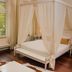 Hotel Villa Marstall, Heidelberg: elegant room with canopy bed, wood floors and tall window