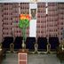 Hotel Buddha International in Bodh Gaya lobby with black chairs, coffee tables and flower vase
