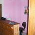 Jaegerstube in Görgeshausen reception desk with wooden counter, pink walls and black chair