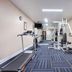 Baymont Inn & Suites Lake City fitness room with treadmills, elliptical, and weight machine