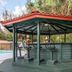 Baymont Inn & Suites Lake City poolside gazebo with seating and red roof