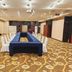 Xinji Garden Hotel Nanchang meeting room with U-shaped table setup and projector
