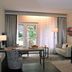 Parkhotel Tjaarda in Oranjewoud, guest room with desk, sofa, bed and large window