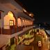 Hotel Harasar Haveli in Bikaner courtyard at night with arched balconies and city lights