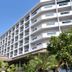 BP Samila Beach Hotel and Resort in Songkhla, exterior of multi-story hotel with palm trees