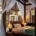 Villa Canggu by Plataran in North Kuta, four-poster bed with sheer drapes and pool view