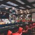Cannery Casino Hotel North Las Vegas bar with red stools and backlit liquor shelves