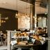 Motel One München-Westend breakfast buffet with pastries and seating in Munich