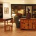 The Kairaba Beach Hotel in Serrekunda lobby with carved statue, wooden cabinet, and seating area