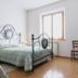 Agriturismo Barbi in Pienza guest room with wrought-iron beds, tiled floor and window