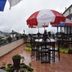 Hotel Apple Valley rooftop terrace in Kodaikanal with outdoor tables, umbrellas, and hillside views