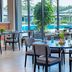 Ibis Styles Sepang Klia restaurant with poolside view through floor-to-ceiling windows