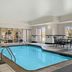 Indoor pool at Fairfield Inn & Suites by Marriott Paducah with seating and large windows