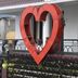 Hotel Apple Valley in Kodaikanal with a large red heart sculpture on the porch