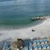 Gulfview Hotel - On the Beach in Clearwater Beach with beach chairs, thatched umbrellas and ocean view