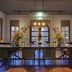 Parkhotel Tjaarda dining room in Oranjewoud with long table, flowers and warm pendant lights