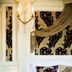 Luxury Family Hotel Royal Palace, Prague: ornate guest room with canopy bed and wall sconce