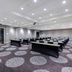 Hampton Inn & Suites Raleigh-Durham Airport-Brier Creek meeting room in Raleigh with rows of tables and chairs