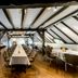 Fletcher Hotel-Restaurant De Klepperman in Hoevelaken, attic-style restaurant with long dining tables