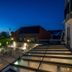 Bij Jef in Den Hoorn with illuminated terrace seating and ocean view at dusk