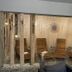 Berghotel Drei Brüder Höhe in Marienberg: rustic indoor lounge with woven chairs and stone accents