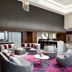 Hilton Woodland Hills/Los Angeles lobby with seating area, high ceiling, and pink patterned rug