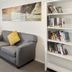 Aristotles North Shore in Auckland lounge with gray sofas, bookshelves, and window seating