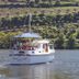 Quinta Nova Winery House - Relais & Châteaux boat on the Douro River near terraced hills in Covas do Douro
