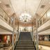 Parkhotel Tjaarda in Oranjewoud grand lobby with central staircase and chandelier
