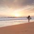Surfers on a sunset beach near Hôtel Mercure La Roche Sur Yon Centre in La Roche-sur-Yon