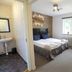 Kosta Lodge, Kosta guest room with bed, window, wall TV, chair and en suite sink