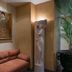 Neuilly Park Hotel lobby corner in Neuilly-sur-Seine with red sofa, statue and potted palm