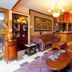 Lobby lounge at New Hotel Kuc by Marvel in Sveti Stefan with tufted sofas, coffee tables and wood accents.