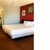 OYO Hotel Georgia Near Fairburn/Atlanta room in Union City with king bed, desk and wall art