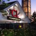 The Champagne Lodge & Luxury Suites in Willowbrook exterior with illuminated entrance sign at dusk