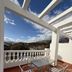 Hotel Mirasol in Órgiva terrace with table, chairs, pergola and mountain views