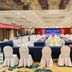Xinji Garden Hotel in Nanchang ballroom set for a banquet with rows of white-covered chairs and tables