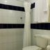 Hotel Villa Serena San Benito bathroom with shower, toilet and sink in San Salvador