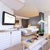 Vibe Hotel Singapore Orchard room with king bed, sofa seating and bright window in Singapore