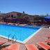 Residence Esmeraldo in Capo Vaticano: outdoor swimming pool with lounge chairs and umbrellas