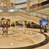 Parkyard Hotel Jiaxing in Jiaxing lobby with grand staircase, circular floor design and central floral sculpture